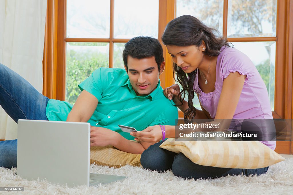 Couple making online transaction