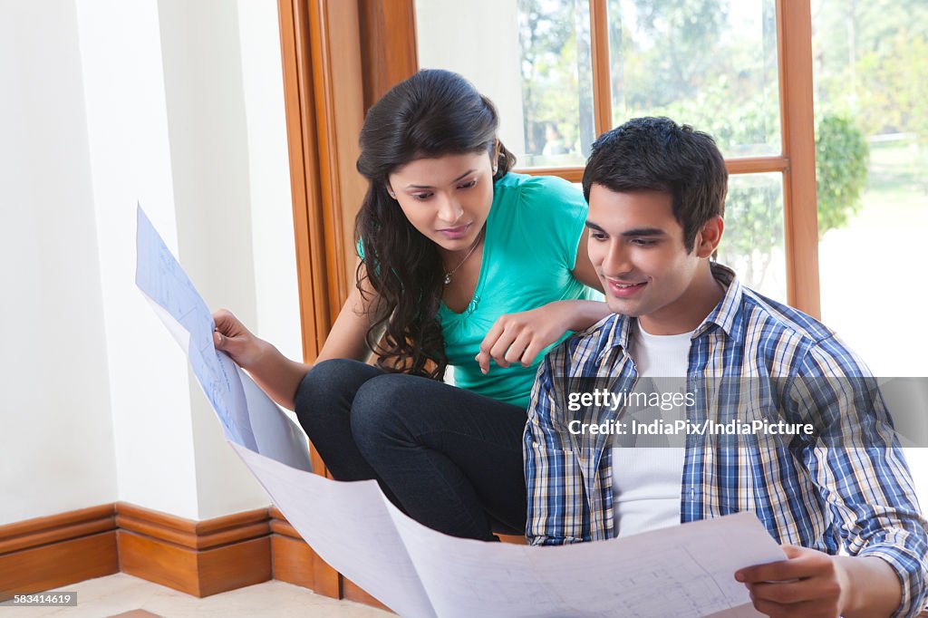 Couple looking at a sheet