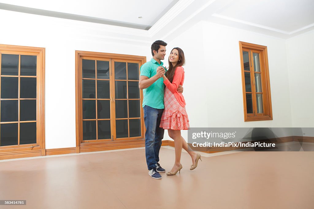 Young man and young woman dancing