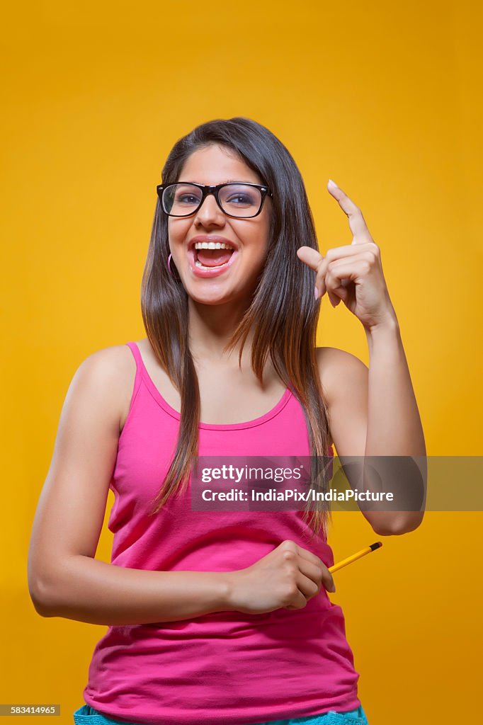 Young woman student showing her excitement