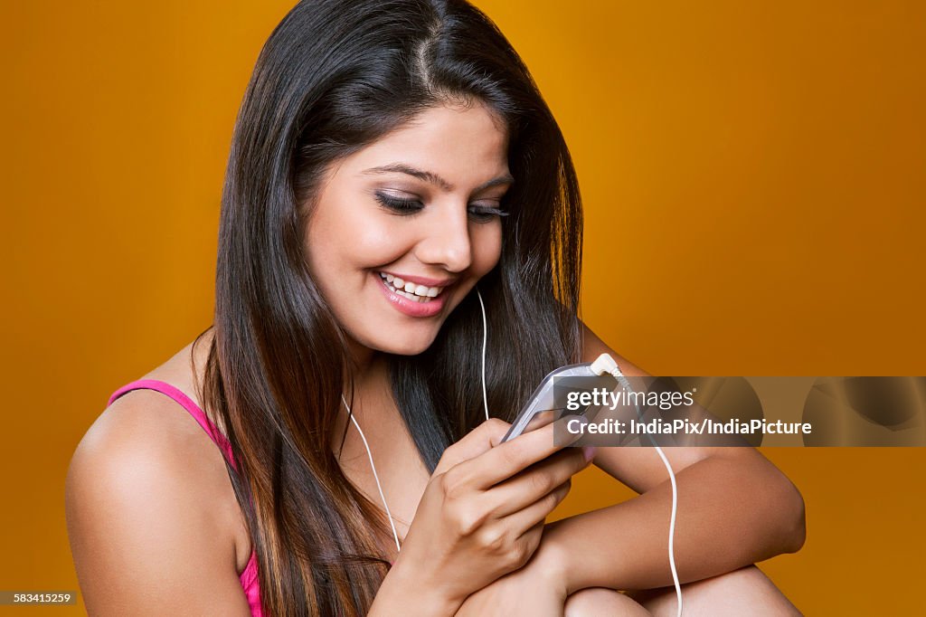 Young woman listening to music