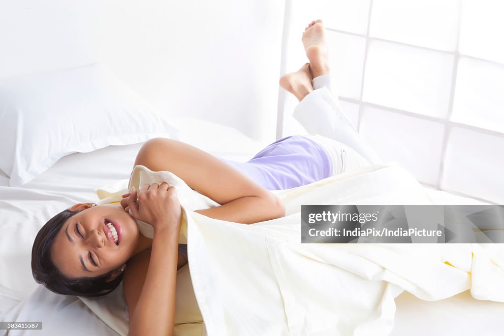 Girl smiling in bed