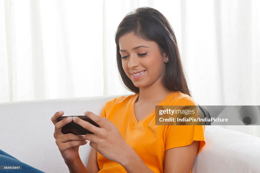 Girl reading sms on mobile phone