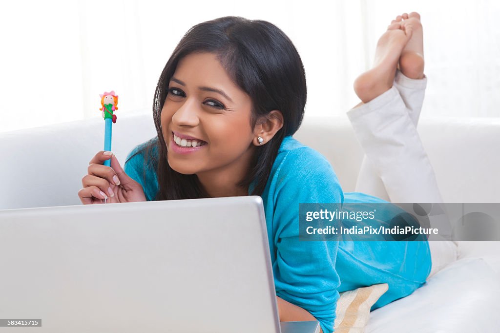 Portrait of girl with laptop smiling