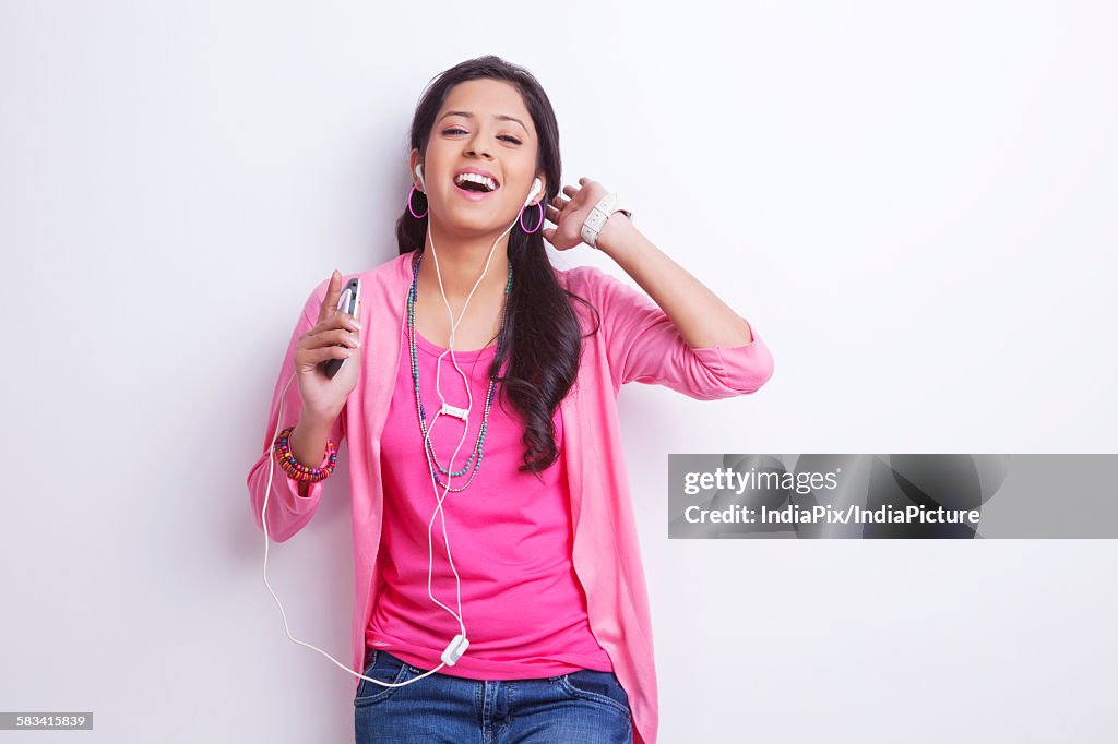 Portrait of girl listening to music