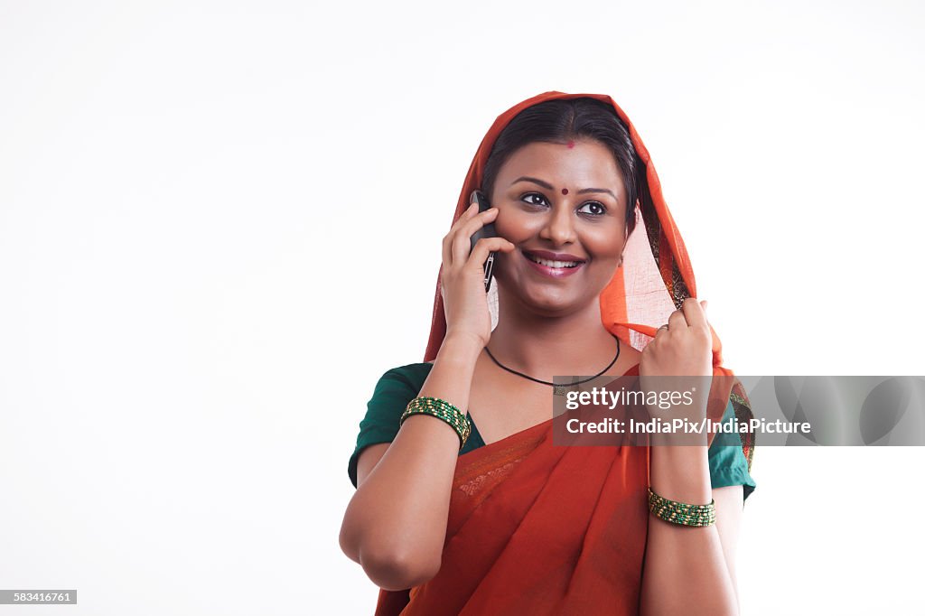 Rural woman talking on mobile phone