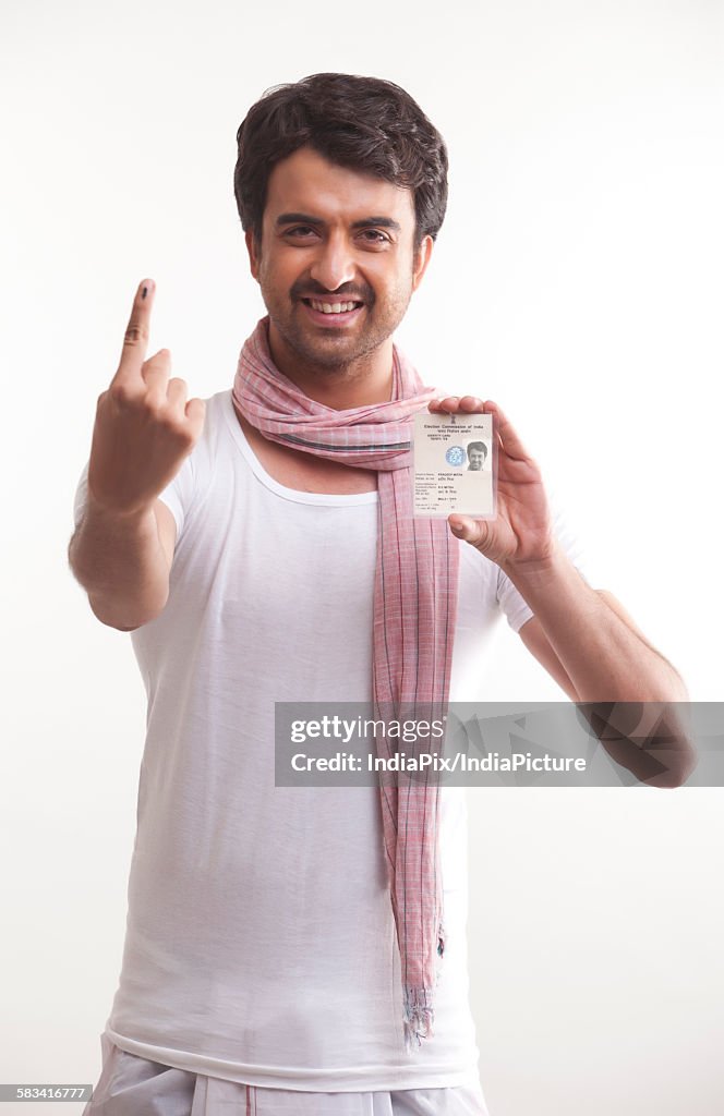 Farmer with voters mark and identity card