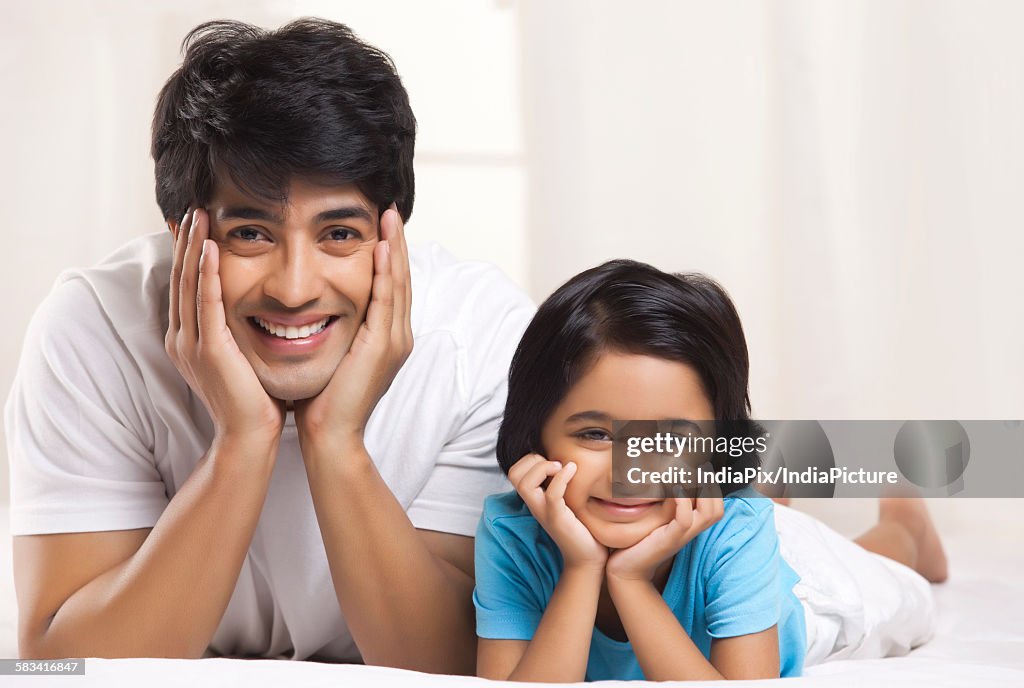 Portrait of father and son smiling