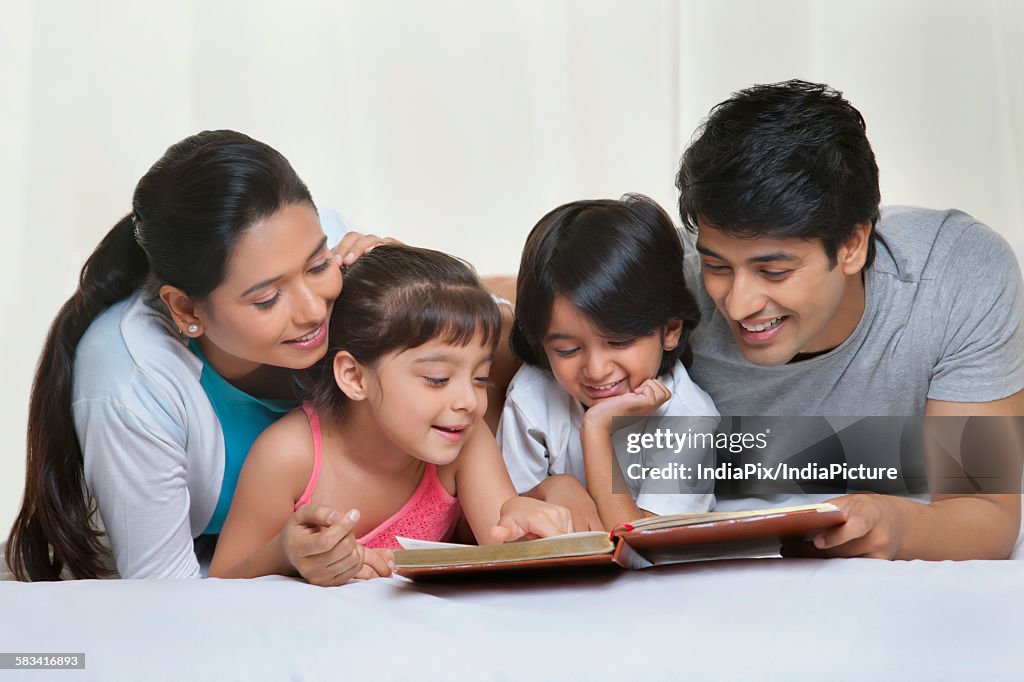 Family reading a book