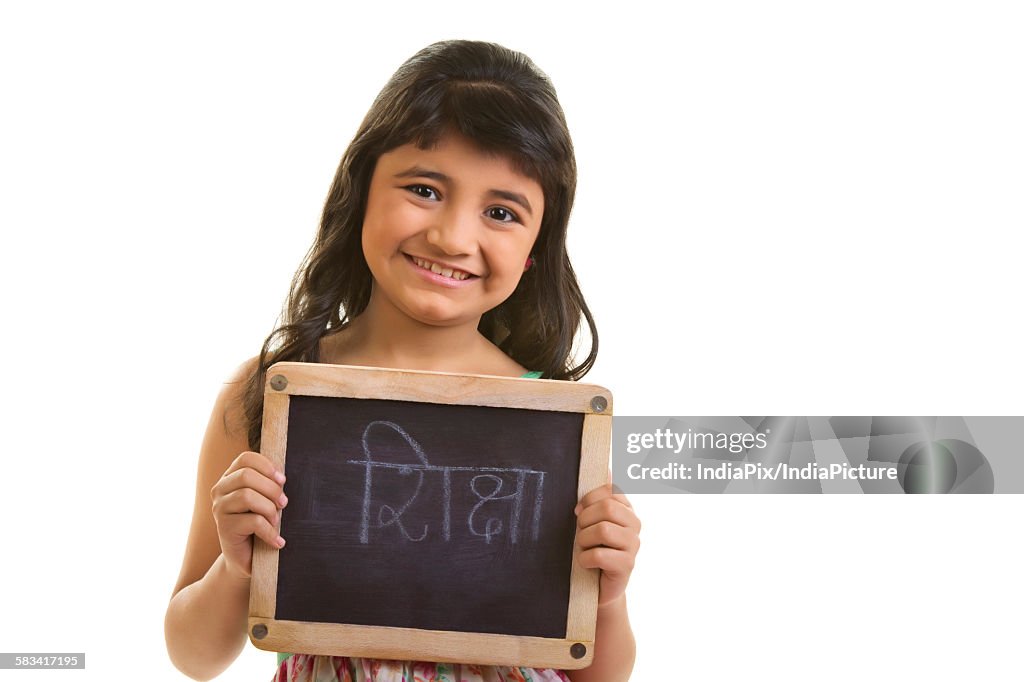 Girl holding black board