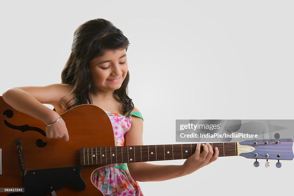 Girl playing the guitar