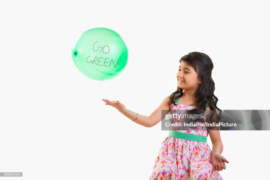 Girl playing with a balloon