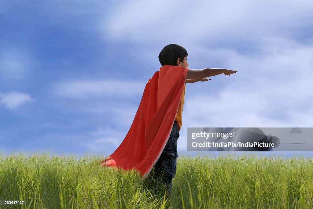 Child posing as Superman