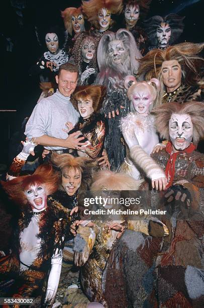 The cast of the musical Cats decked out in all their furry feline finery, pose with their director, John Yost, during their Paris season at the...