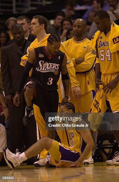 Allen Iverson of the Philadelphia 76ers steps over Tyrone Lue of the Los Angeles Lakers in Game 1 of the NBA Finals at Staples Center in Los Angeles,...