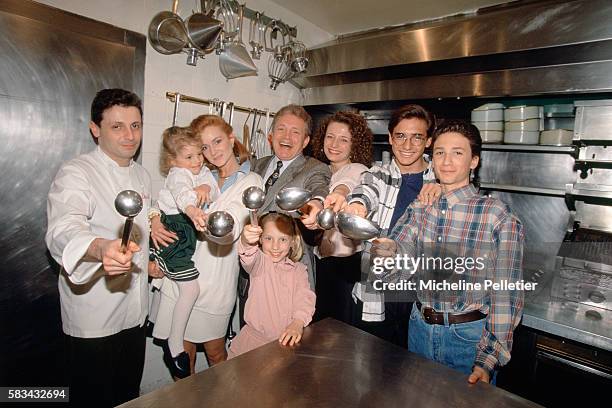 French entertainer Jacques Martin standing in the kitchen of a restaurant with his wife Celine and his six children : David , Elise , Frederic , Jean...