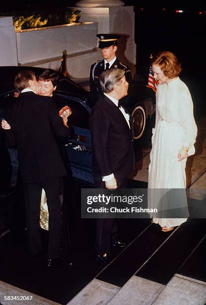 American President Jimmy Carter, left, and his wife Rosalynn, right, greet German Chancellor Helmut Schmidt, second from right, and his wife Loki at...