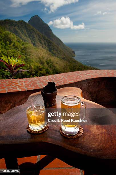 two cool drinks await vacationers over looking the pitons of st lucia. - ron green fotografías e imágenes de stock