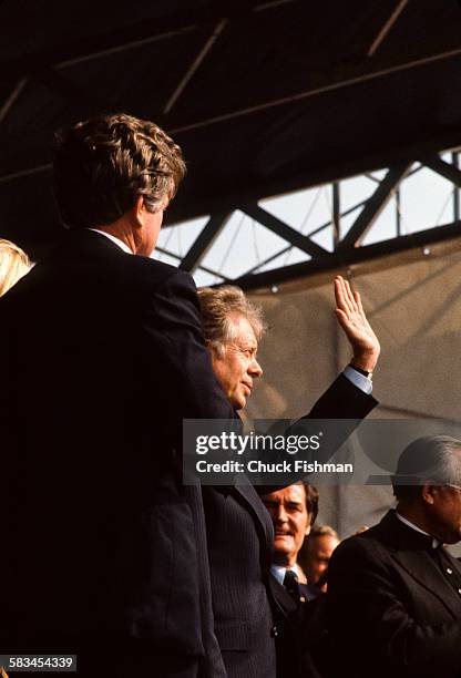 President Jimmy Carter waves to the crowd at the dedication ceremony for the John F. Kennedy Presidential Library and Museum in Boston,...