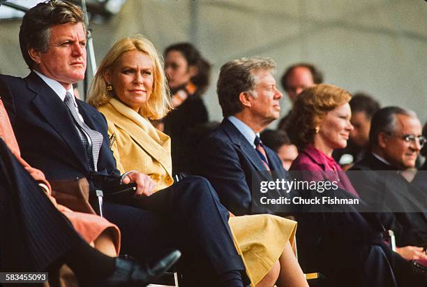 Senator Ted Kennedy, left, sits with his wife Joan, next to President Jimmy Carter, center, and his wife Rosalynn, at the memorial dedication...