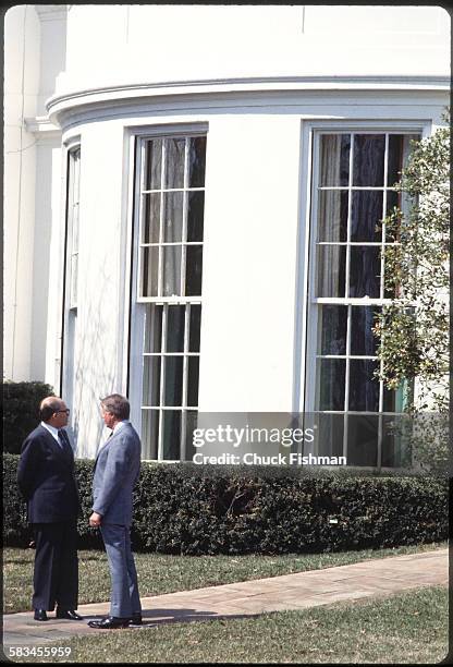 United States President Jimmy Carter, right, converses with Israeli Prime Minister Menachem Begin outside the Oval Office at the White House,...