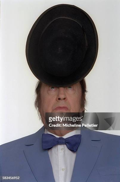 Comedian Raymond Devos Balancing Hat on Nose