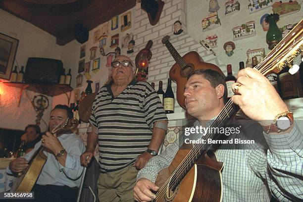 Fado singer and guitar-players at the 'Cabacinha' club.