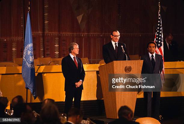 Secretary General Kurt Waldheim address the United Nations on the signing of the Human Rights Bill, with American President Jimmy Carter standing on...