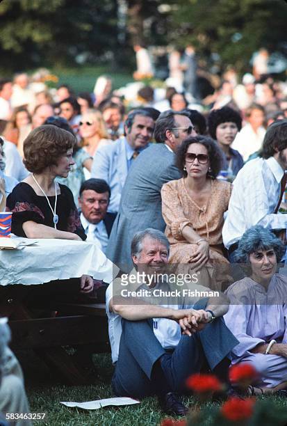 President Jimmy Carter, center, seated on the South Lawn of the White House during the White House Jazz Concert on the occasion of the 25th...