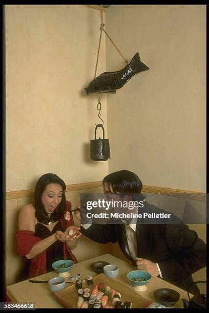 Sarah Abitbol and St{phane Bernardis at a restaurant.