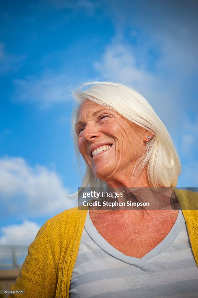 Portrait of fit "senior" woman at the beach