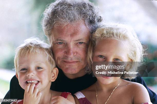 French television host Jacques Martin enjoys time with two of his seven children, daughters Judith and Jeanne-Marie .
