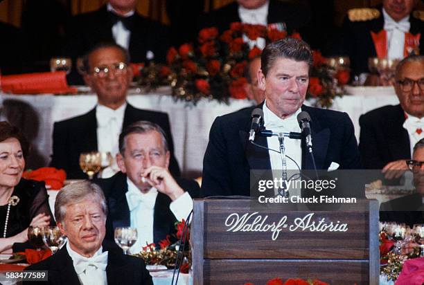 President Jimmy Carter and Ronald Reagan attend the Al Smith dinner at the Waldorf Astoria in New York, October 1980.