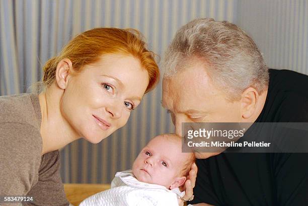 French television personality Jacques Martin and his wife Celine holding their one-month-old infant Clovis. Jacques Martin is a television host,...