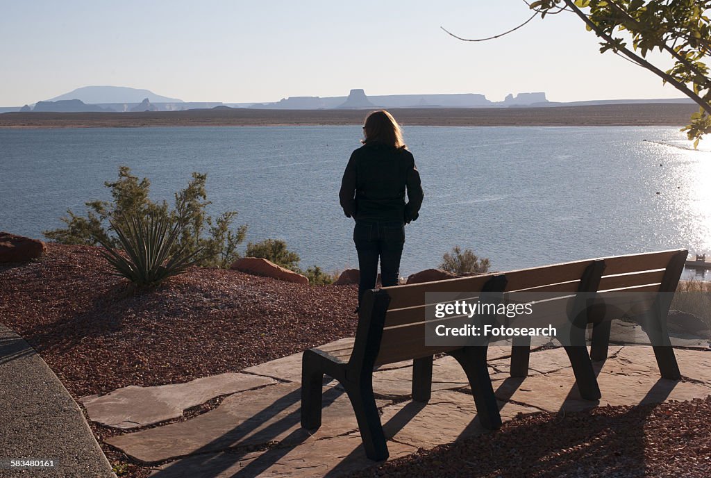 Woman standing at the lakeside