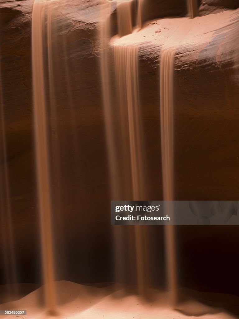 Sand falling in a slot canyon