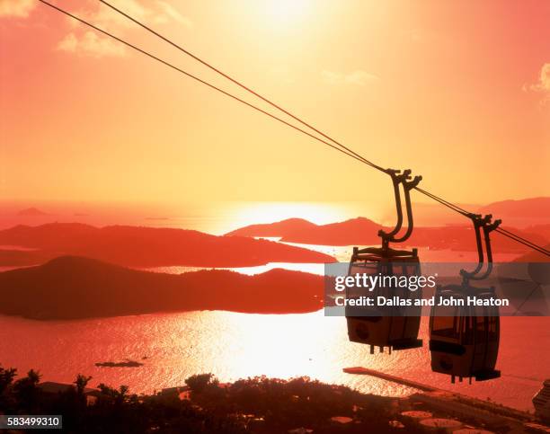 aerial tram over caribbean bay at sunset - us virgin islands stock pictures, royalty-free photos & images