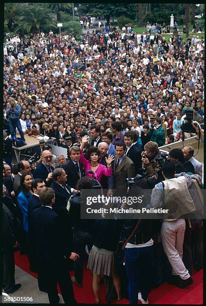 Gina Lollobrigida is swamped by the crowd on her visit to the Film Festival.