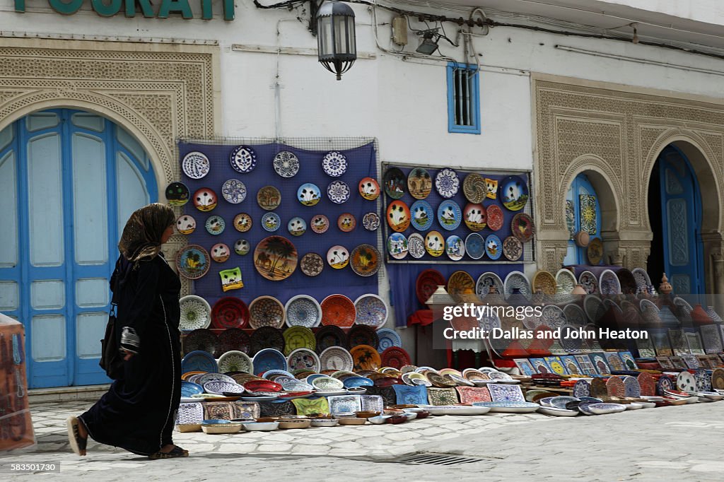 Africa, North Africa, Tunisia, Kairouan, Medina Street Scene, Handicraft Stalls, Woman