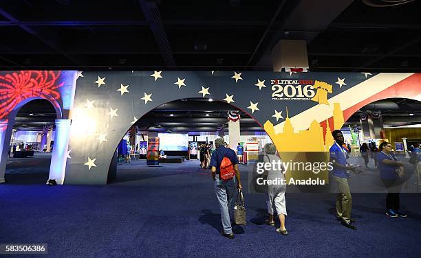 Democratic Party voters investigate the hall stands at congress hall where the presidential candidate will be elected, ahead of 58th Presidential...