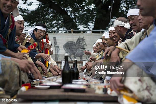Samurai horsemen participate in the Generals' Meeting during the Soma Nomaoi festival in Minamisoma, Fukushima Prefecture, Japan, on Saturday, July...