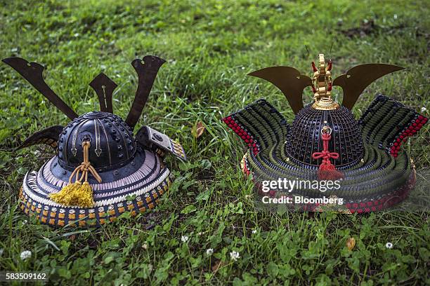 Samurai helmets known as Kabuto sit on the ground during the Soma Nomaoi festival in Soma, Fukushima Prefecture, Japan, on Saturday, July 23, 2016....