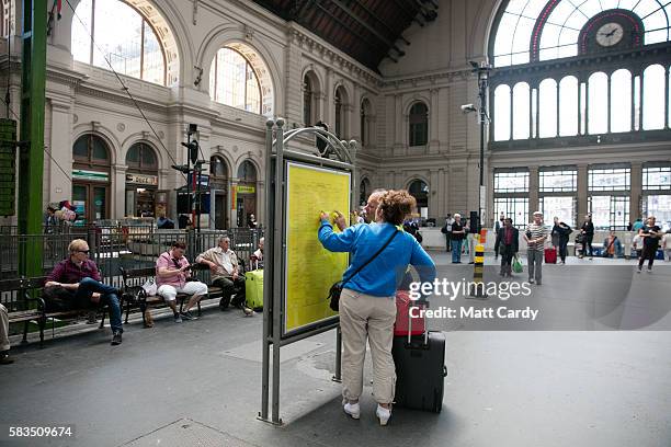 Travellers wait for trains at Keleti Station on July 15, 2016 in Budapest, Hungary. Last summer thousands of refugees and migrants were using the...