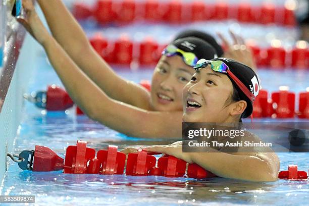 Eriko Ikee and Natsumi Sakai (back of Japan swimming team in a training session on July 25, 2016 in Rio de Janeiro, Brazil.