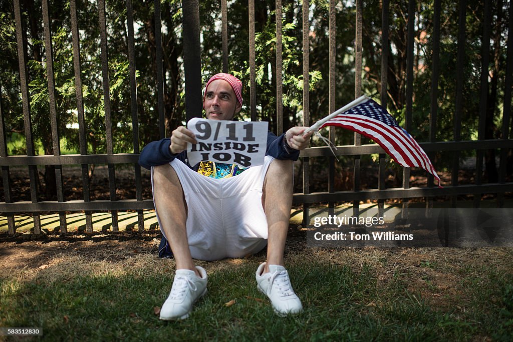 Jonathan Lee Riches sits along Broad St., before a march by... News Photo -  Getty Images