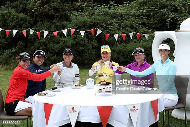 Charley Hull of England hosts a traditional English tea party for her fellow golfers at a photocall held at her home club, Woburn GC, Brittany Lang...