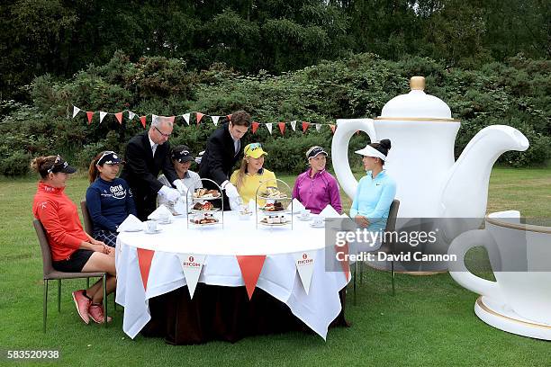 Charley Hull of England hosts a traditional English tea party for her fellow golfers at a photocall held at her home club, Woburn GC, Brittany Lang...