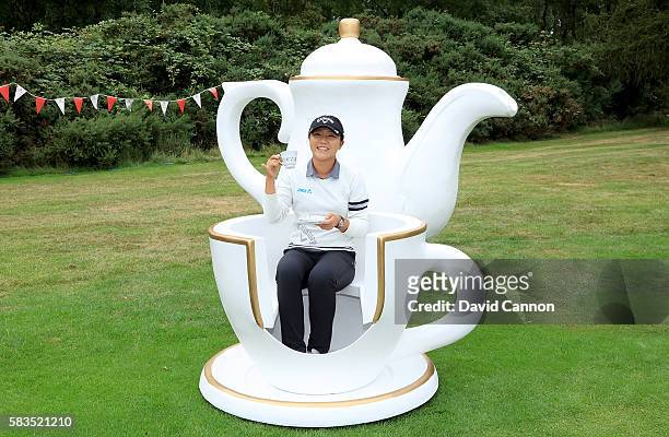 Lydia Ko of New Zealand attends a traditional English tea party hosted by Charley Hull of England at a photocall during a Pro-Am round ahead of the...