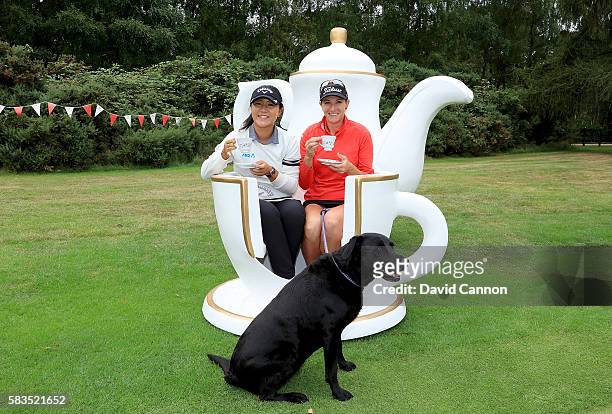 Lydia Ko of New Zealand and Brittany Lang of the United States attend a traditional English tea party hosted by Charley Hull of England at a...
