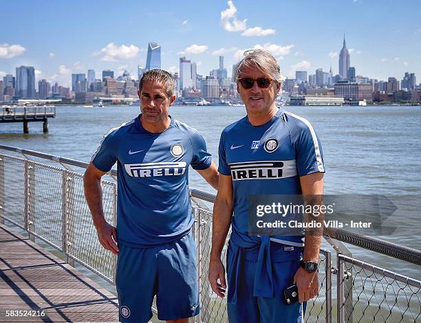 Head Coach FC Internazionale Roberto Mancini and assistant coach Sylvinho pose for a photo in front of the New York skyline after the FC...